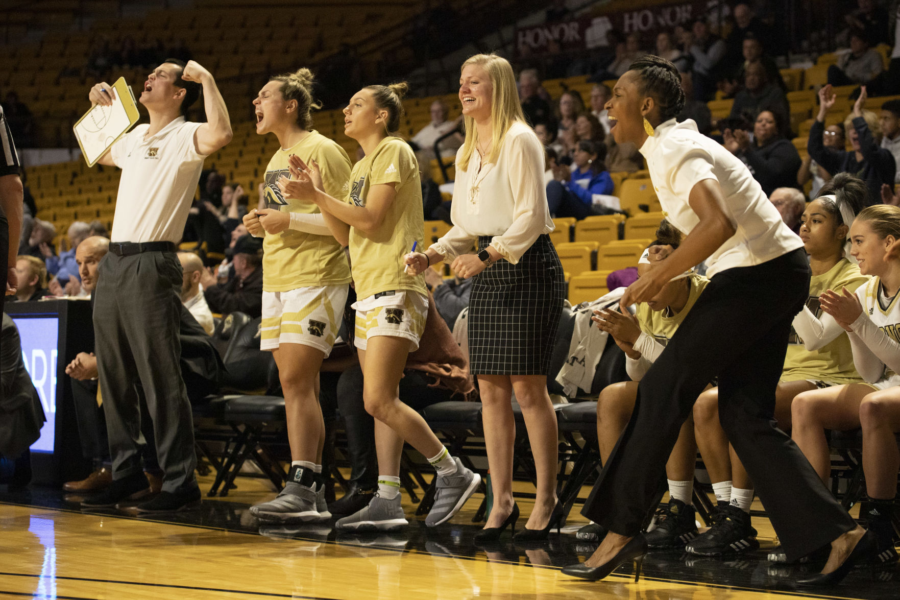 Teammates and coaching staff celebrate as WMU takes the lead in the fourth quarter.